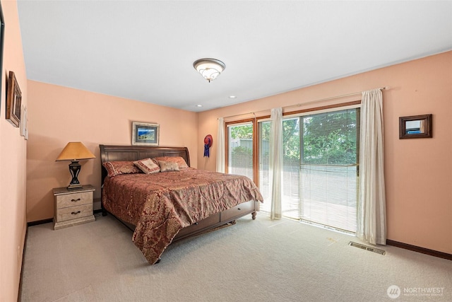9138 Edgewater Dr SW, Lakewood, WA 98499 - carpeted bedroom featuring access to outside and baseboards