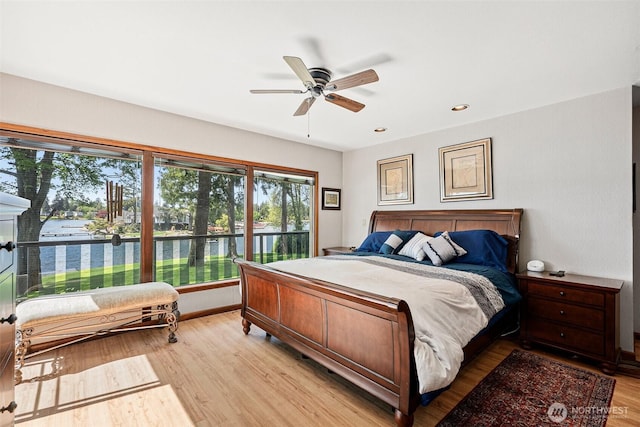 9138 Edgewater Dr SW, Lakewood, WA 98499 - bedroom with a water view, light wood-style flooring, recessed lighting, baseboards, and a ceiling fan