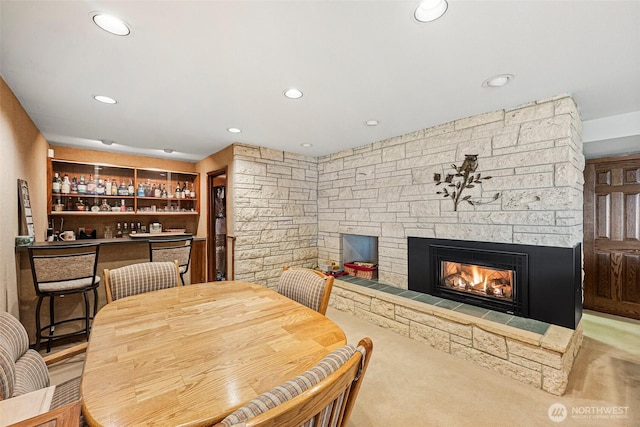9138 Edgewater Dr SW, Lakewood, WA 98499 - dining space featuring a stone fireplace, recessed lighting, and carpet
