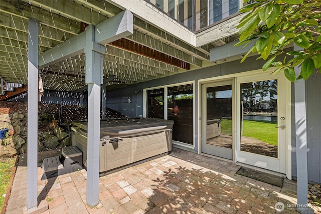 9138 Edgewater Dr SW, Lakewood, WA 98499 - view of patio / terrace featuring a hot tub, stairway, and a water view