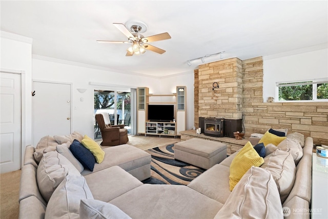 4325 E B St, Tacoma, WA 98404 - carpeted living area featuring ceiling fan, rail lighting, and a wood stove