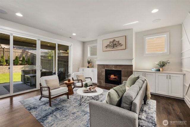 8009 197th Ave E, Bonney Lake, WA 98391 - living area with healthy amount of natural light, a fireplace, dark wood finished floors, and recessed lighting
