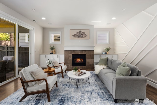 8009 197th Ave E, Bonney Lake, WA 98391 - living area with wood finished floors, a tile fireplace, plenty of natural light, and recessed lighting