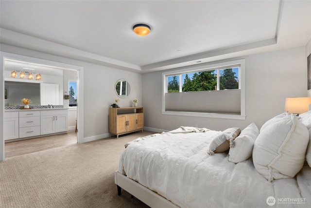 8009 197th Ave E, Bonney Lake, WA 98391 - bedroom featuring a raised ceiling, light colored carpet, and ensuite bathroom