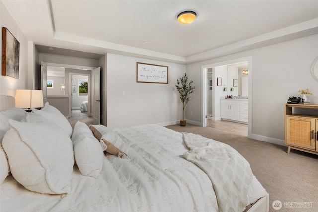 8009 197th Ave E, Bonney Lake, WA 98391 - bedroom with a tray ceiling, light colored carpet, and connected bathroom