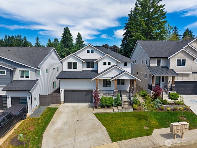 8009 197th Ave E, Bonney Lake, WA 98391 - craftsman inspired home with covered porch, a garage, driveway, a residential view, and a shingled roof