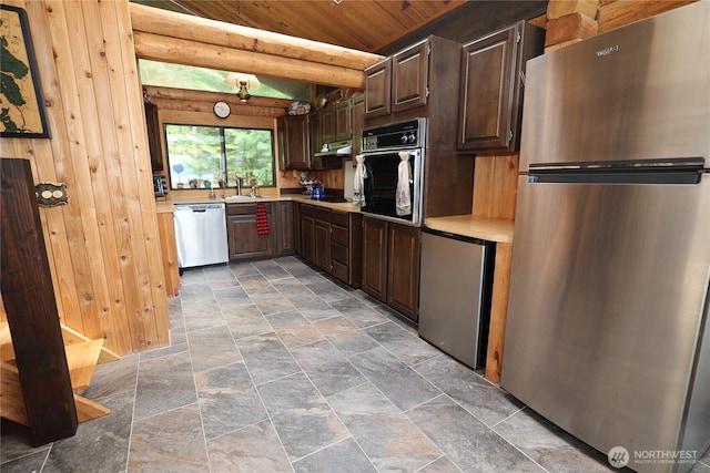 209 Marine Dr, Blakely Island, WA 98222 - kitchen with black appliances, light stone finish flooring, light countertops, wooden ceiling, and dark brown cabinets