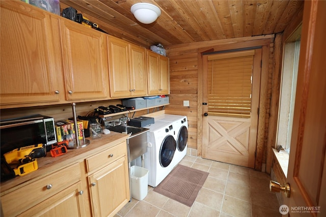 209 Marine Dr, Blakely Island, WA 98222 - laundry room with washer and dryer, wood ceiling, light tile patterned floors, wooden walls, and cabinet space