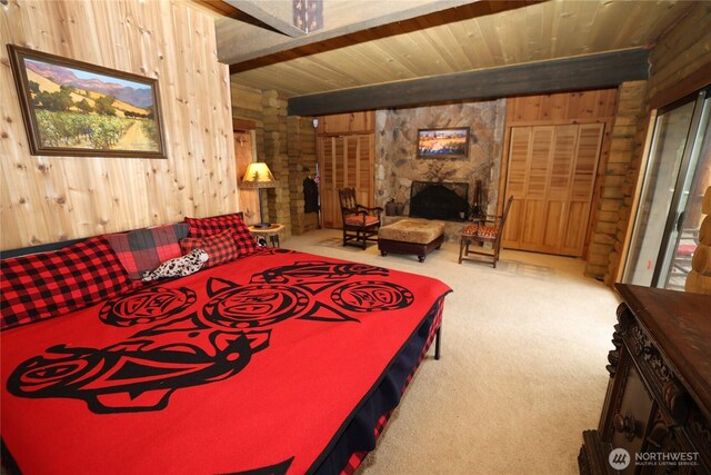 209 Marine Dr, Blakely Island, WA 98222 - bedroom featuring wood walls, carpet flooring, a fireplace, and a wood ceiling with exposed beams