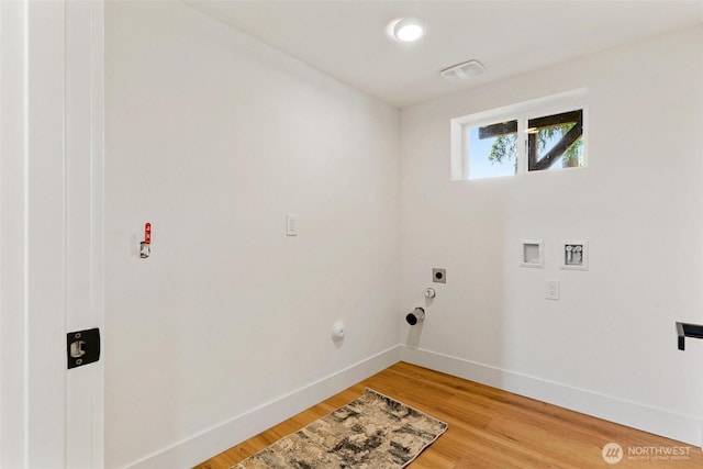 236 S 316th Pl, Federal Way, WA 98003 - laundry area with gas dryer hookup, electric dryer hookup, baseboards, washer hookup, and light wood-type flooring