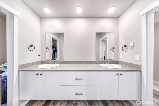 2912 Sandwood Ln, Blaine, WA 98230 - full bath with double vanity, a walk in closet, and wood finished floors