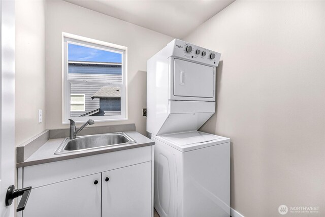 2912 Sandwood Ln, Blaine, WA 98230 - laundry area featuring estacked washer and dryer and cabinet space