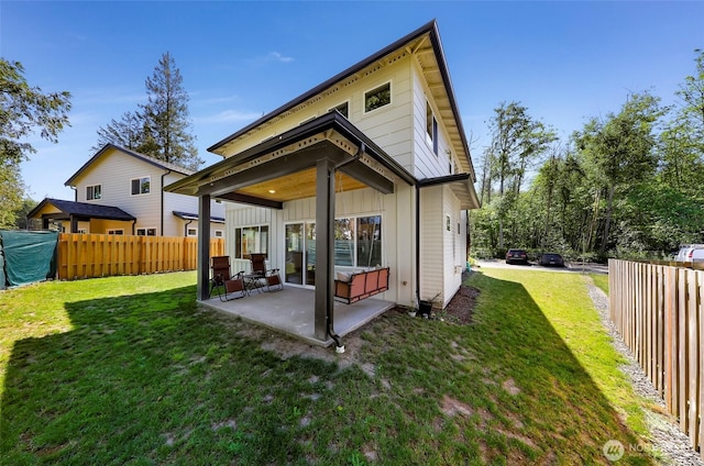 2912 Sandwood Ln, Blaine, WA 98230 - rear view of house featuring a patio area and board and batten siding
