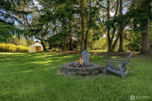 26742 94th Ave SW, Vashon, WA 98070 - view of grassy yard featuring an outdoor fire pit