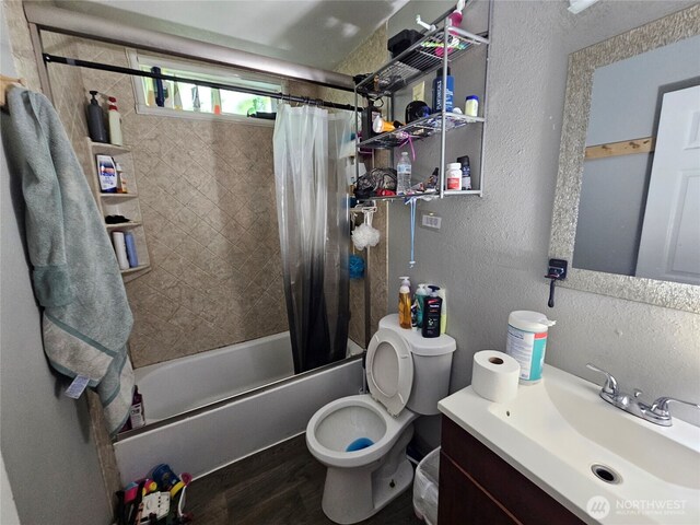 947 19th Ave, Longview, WA 98632 - bathroom featuring a textured wall, shower / bathtub combination with curtain, vanity, toilet, and wood finished floors
