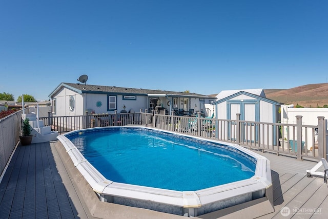 307 Hilltop Cir, Ephrata, WA 98823 - view of pool featuring a wooden deck and a fenced backyard