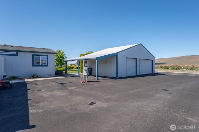 307 Hilltop Cir, Ephrata, WA 98823 - view of car parking featuring a garage