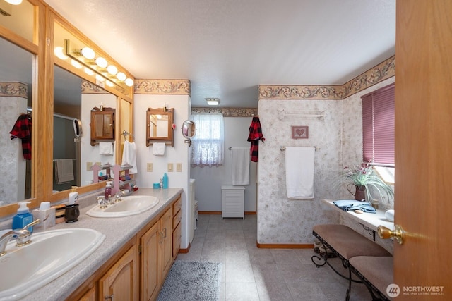 307 Hilltop Cir, Ephrata, WA 98823 - full bathroom featuring baseboards, double vanity, toilet, and a shower with door