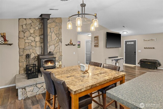 1091 Big Horn Way, Cle Elum, WA 98922 - dining area with a wood stove, baseboards, and wood finished floors
