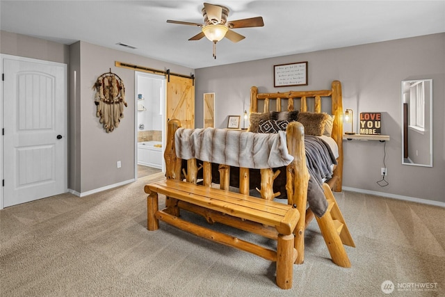 1091 Big Horn Way, Cle Elum, WA 98922 - bedroom featuring carpet flooring, a barn door, baseboards, ensuite bath, and ceiling fan