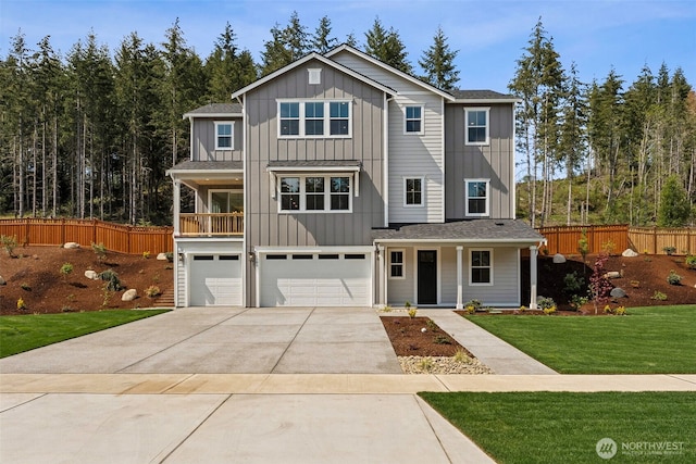 15706 210th Ave E Unit 312, Bonney Lake, WA 98391 - view of front of house with board and batten siding, an attached garage, covered porch, and driveway