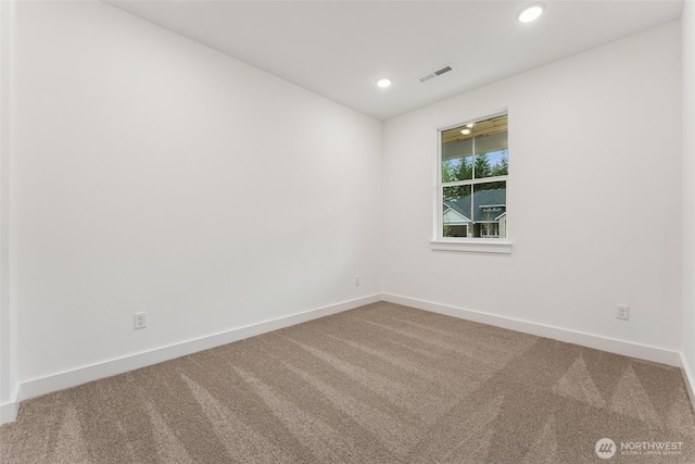15706 210th Ave E Unit 312, Bonney Lake, WA 98391 - carpeted empty room with baseboards and recessed lighting