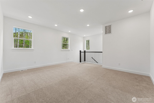 15706 210th Ave E Unit 312, Bonney Lake, WA 98391 - unfurnished room featuring plenty of natural light, recessed lighting, light carpet, and baseboards