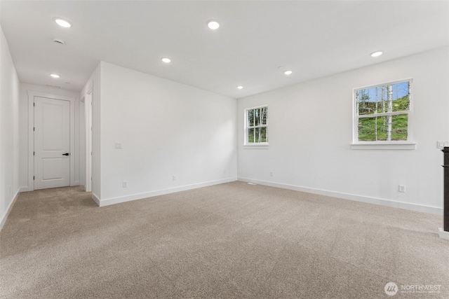 15706 210th Ave E Unit 312, Bonney Lake, WA 98391 - spare room featuring light carpet, recessed lighting, and baseboards