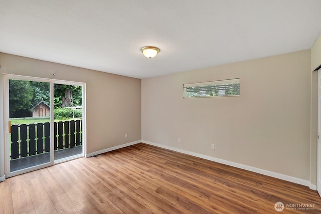 8115 109th St E Unit 8117, Puyallup, WA 98373 - spare room with wood finished floors and baseboards