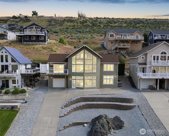 340 W Beach Dr, Orondo, WA 98843 - view of front of home featuring driveway, a garage, and a residential view
