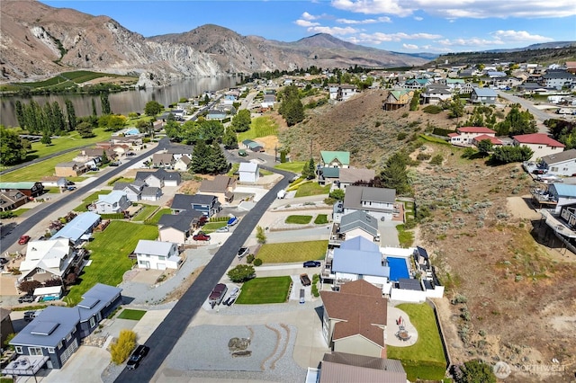 340 W Beach Dr, Orondo, WA 98843 - aerial view of property's location featuring nearby suburban area and a water and mountain view