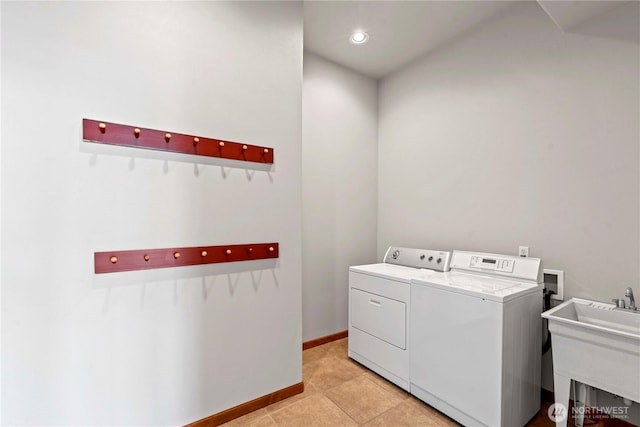 340 W Beach Dr, Orondo, WA 98843 - laundry room featuring washer and dryer, light tile patterned floors, baseboards, and recessed lighting