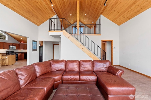 340 W Beach Dr, Orondo, WA 98843 - living room featuring high vaulted ceiling, wooden ceiling, stairs, and baseboards