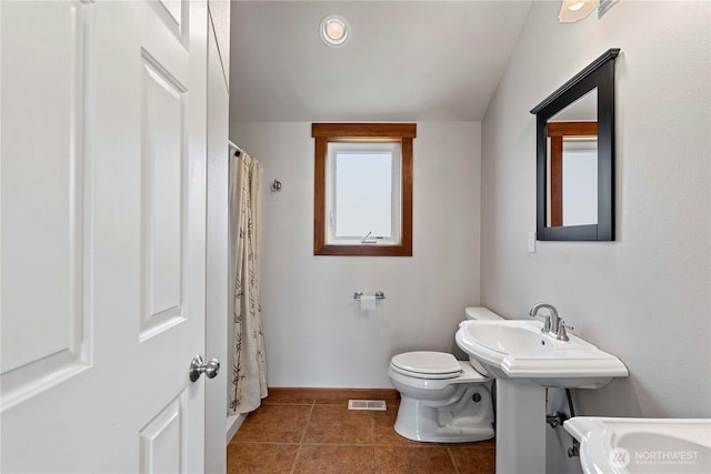 340 W Beach Dr, Orondo, WA 98843 - full bathroom featuring toilet, tile patterned floors, a sink, and baseboards