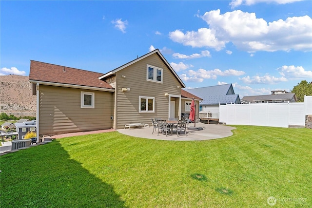 340 W Beach Dr, Orondo, WA 98843 - rear view of house with a patio, a shingled roof, and cooling unit