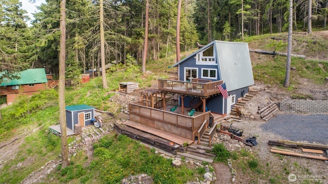 451 Aspen Springs Rd, Cle Elum, WA 98922 - back of house with stairs, a wooden deck, metal roof, and a wooded view
