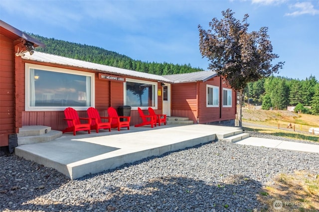451 Aspen Springs Rd, Cle Elum, WA 98922 - back of property with metal roof and a view of trees