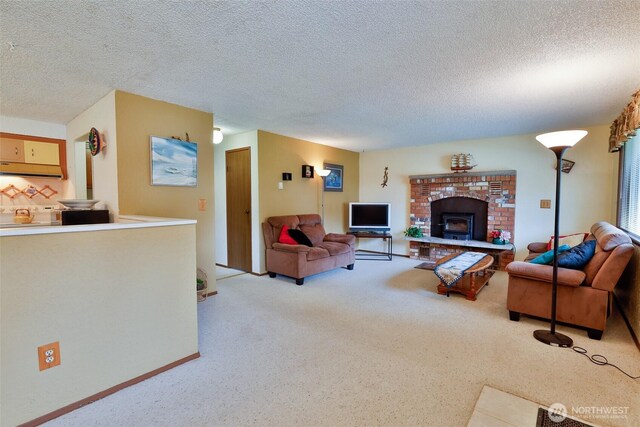 247 Bass Ave NE, Ocean Shores, WA 98569 - living area with carpet floors, a textured ceiling, a brick fireplace, and baseboards