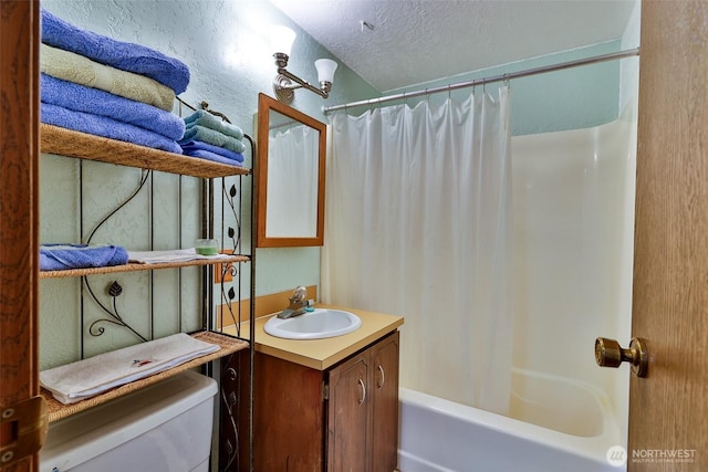 247 Bass Ave NE, Ocean Shores, WA 98569 - bathroom featuring vanity, toilet, shower / bathtub combination with curtain, and a textured ceiling