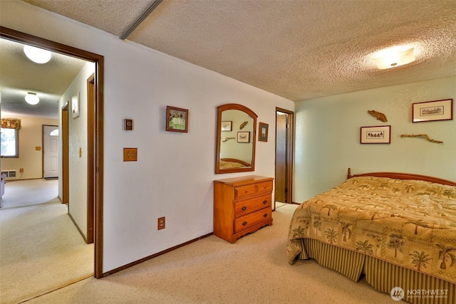 247 Bass Ave NE, Ocean Shores, WA 98569 - bedroom with light colored carpet and a textured ceiling