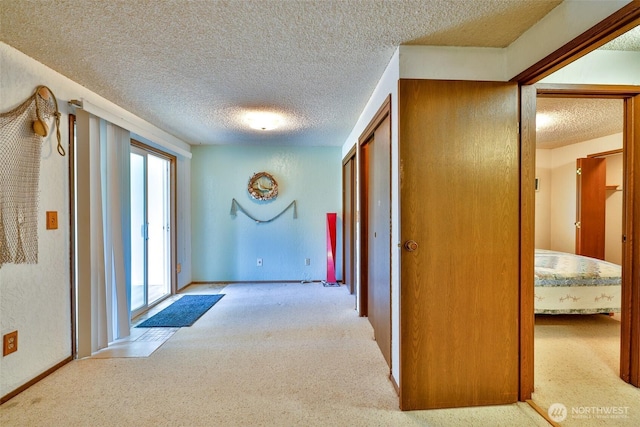 247 Bass Ave NE, Ocean Shores, WA 98569 - hall featuring carpet and a textured ceiling