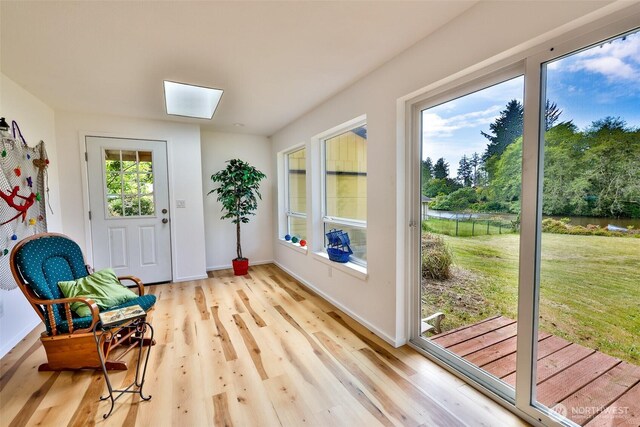 247 Bass Ave NE, Ocean Shores, WA 98569 - sitting room with a skylight, light wood finished floors, and baseboards