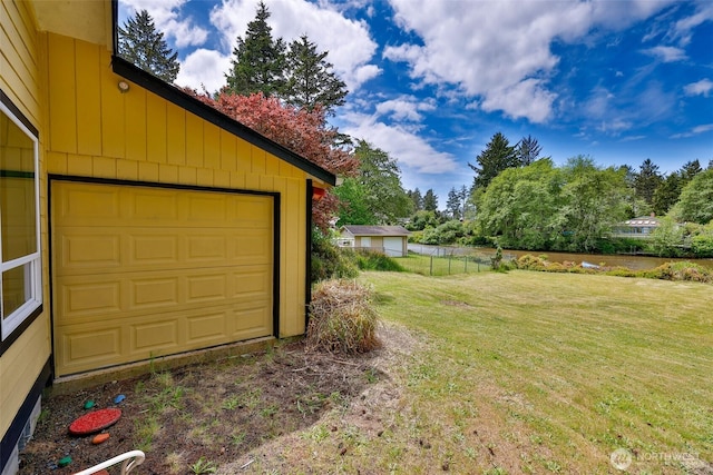 247 Bass Ave NE, Ocean Shores, WA 98569 - view of yard featuring a garage