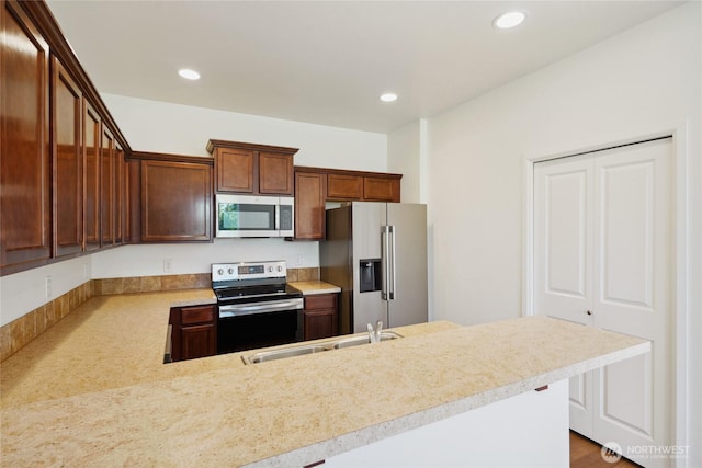 4825 E Q St Unit 2922, Tacoma, WA 98404 - kitchen with appliances with stainless steel finishes, light countertops, recessed lighting, a sink, and a peninsula