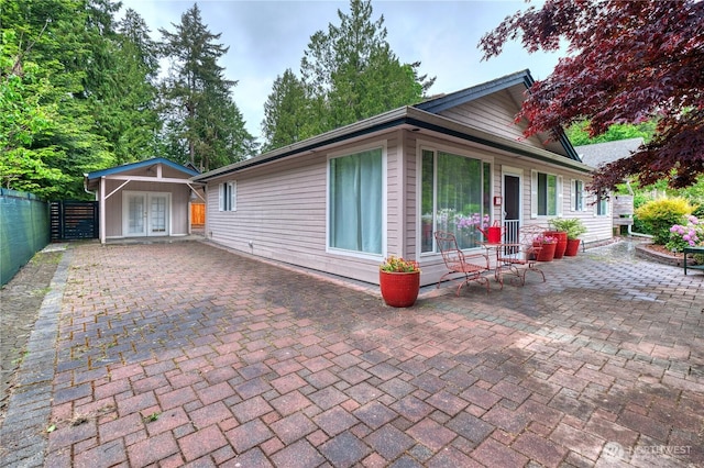 245 Shady Glen Ave, Point Roberts, WA 98281 - view of front facade featuring french doors and a patio area