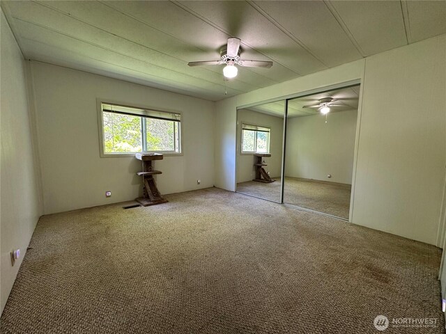 11615 Nisqually Park Loop SE, Olympia, WA 98513 - unfurnished bedroom with carpet flooring, a closet, and ceiling fan