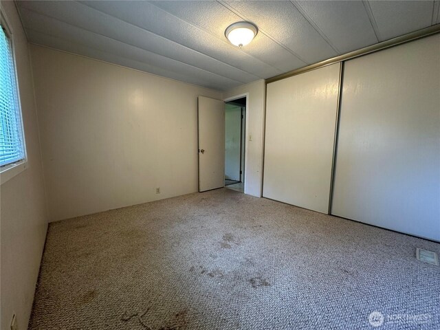 11615 Nisqually Park Loop SE, Olympia, WA 98513 - unfurnished bedroom with carpet flooring and a closet