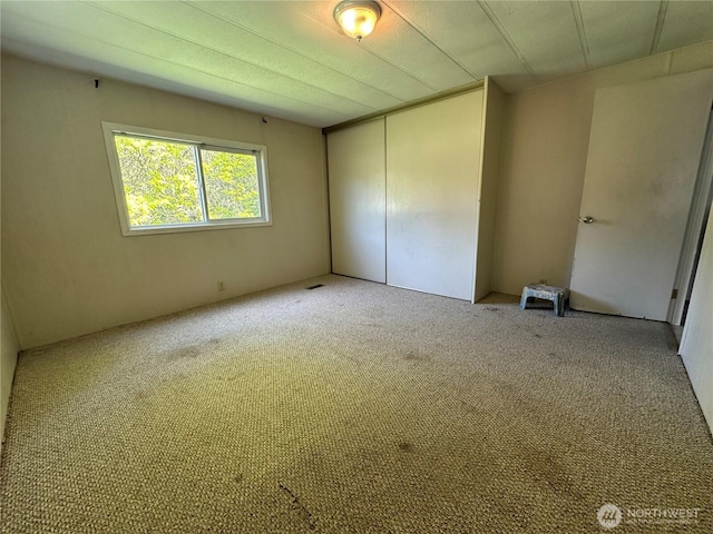 11615 Nisqually Park Loop SE, Olympia, WA 98513 - unfurnished bedroom featuring carpet and a closet