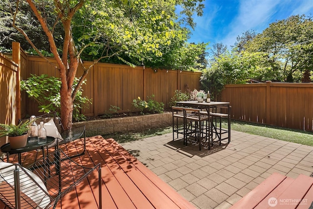 3122 Franklin Ave E Unit A, Seattle, WA 98102 - fenced backyard with outdoor dining space, a wooden deck, and a patio area