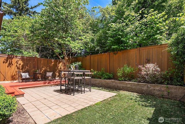 3122 Franklin Ave E Unit A, Seattle, WA 98102 - fenced backyard with a patio area and outdoor dining space